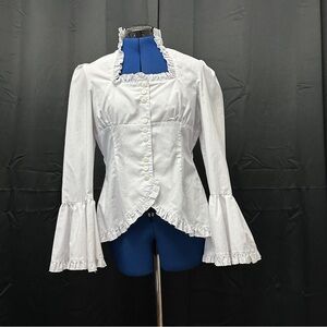 White Retroscope Fashions Top with lace up back and bell sleeves. Retro style